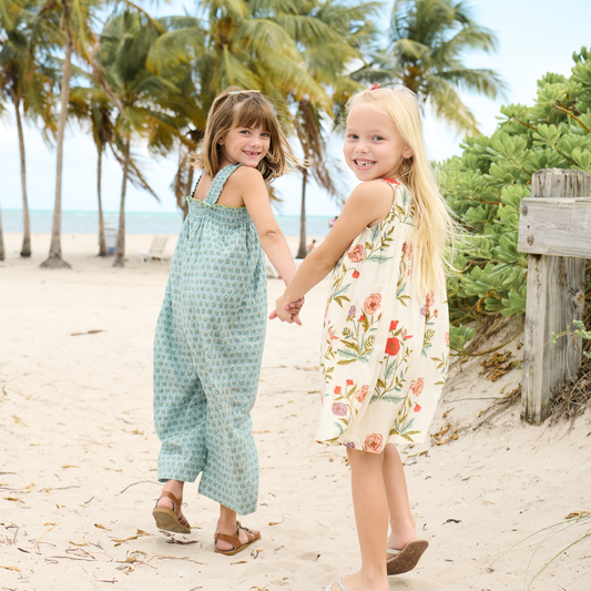 Even pieces with a touch of metallic thread—like this Blue Prairie style—can feel soft and wearable when thoughtfully made. Image of two girls in clothing.